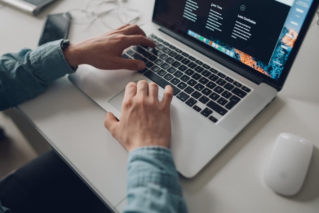Guildford web developer building a website on a laptop