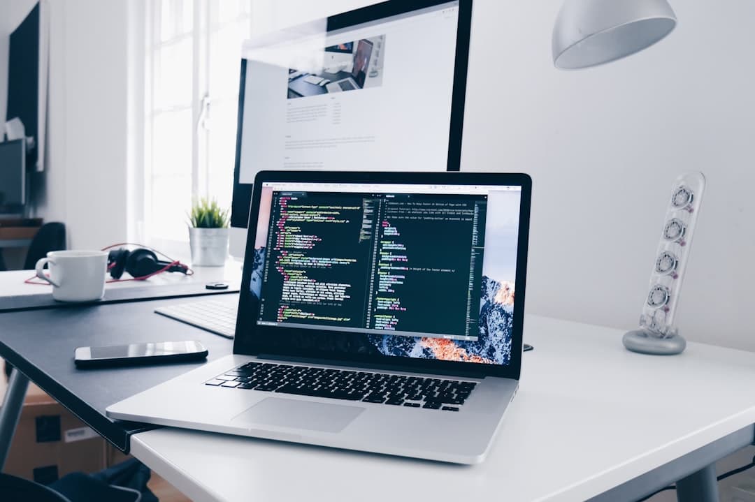 Web designer building a website on a laptop